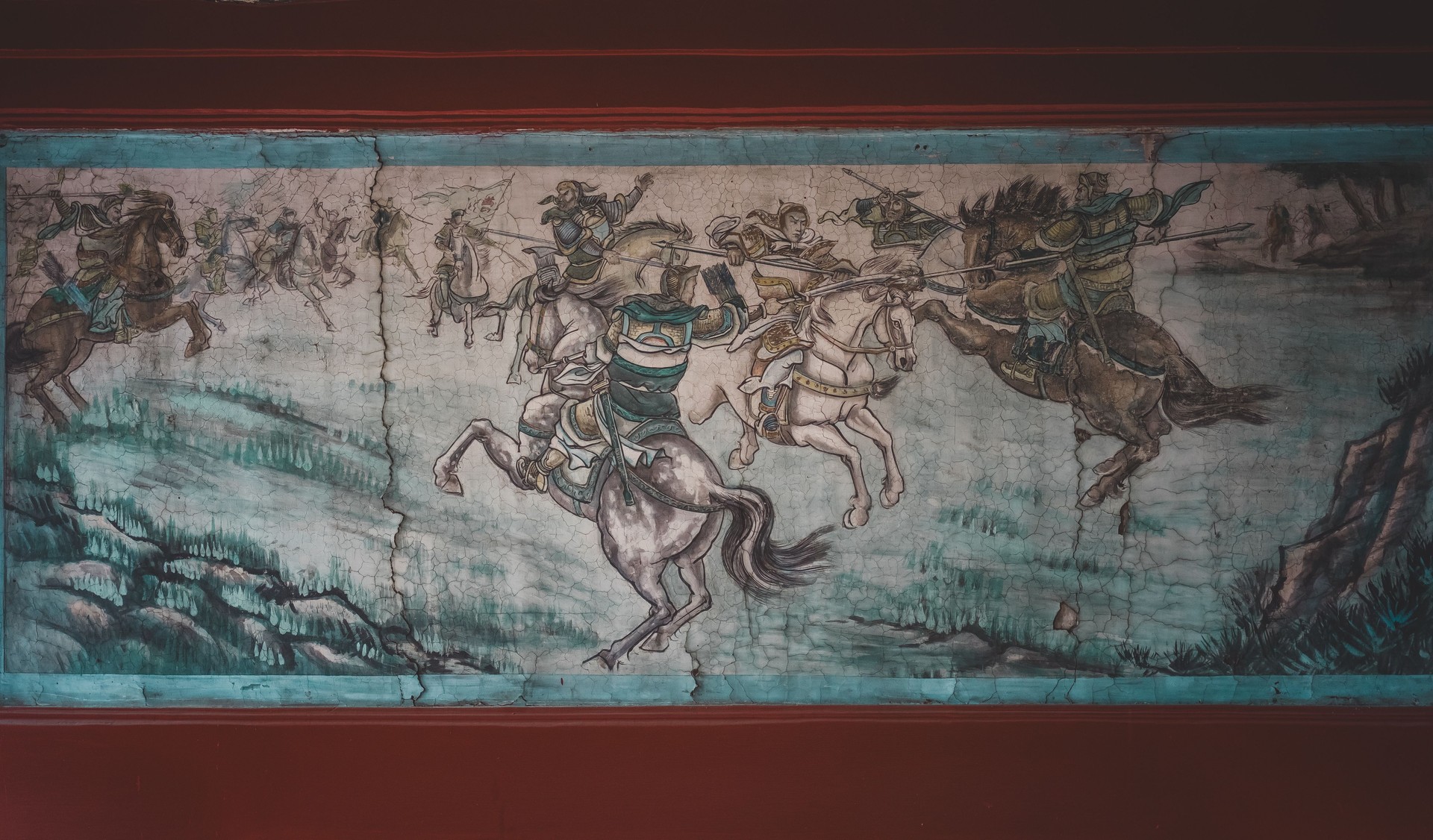 Details of a traditional oriental mural in a Chinese Garden. The architecture reflects Beijing, China's heritage. Artwork painted within a building.